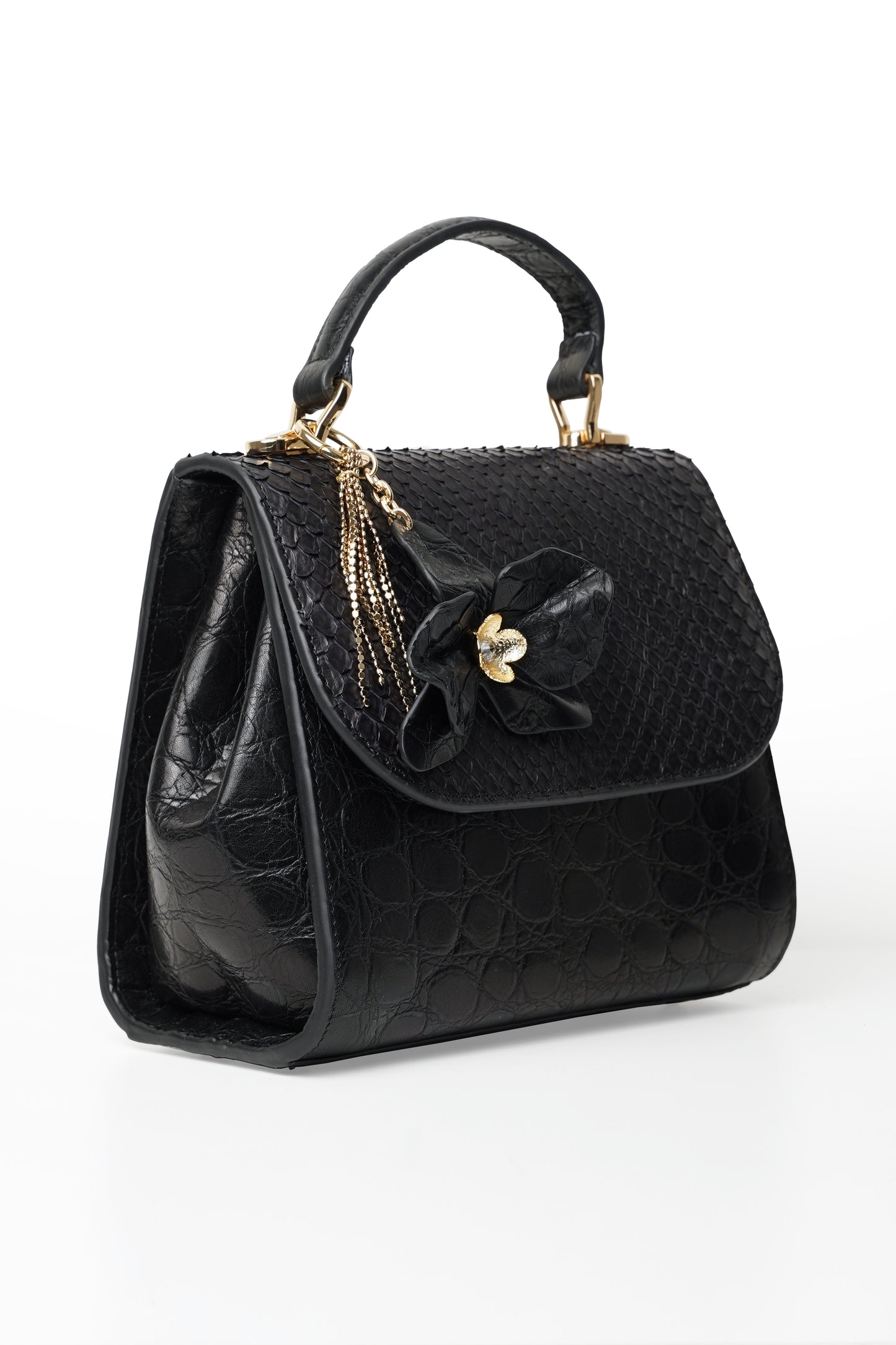 Black orchid handbag with python and ostrich leather and orchid flower charm.