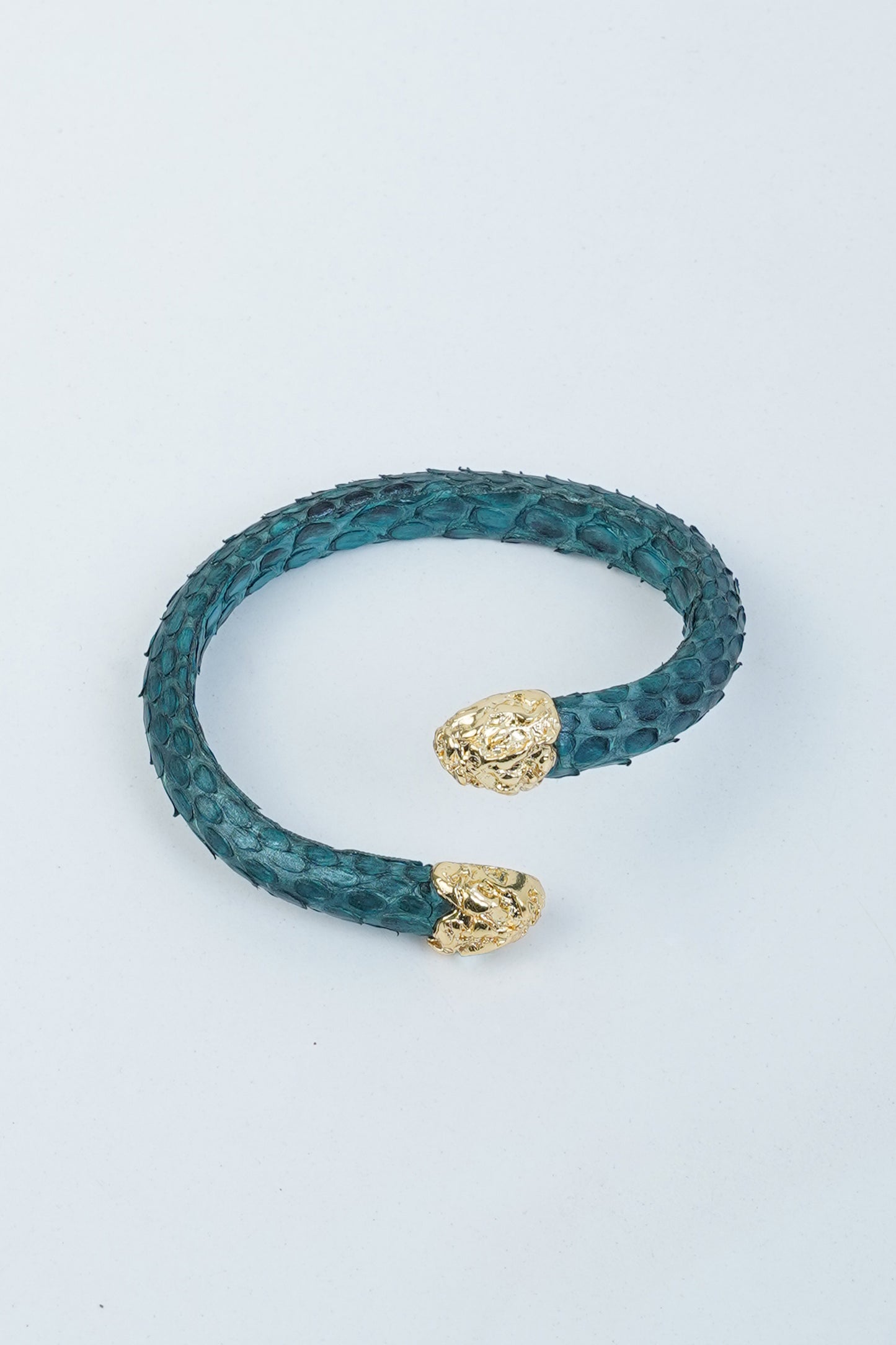Turquoise Hierapolis handmade leather bracelet with gold-plated brass ends on a white background