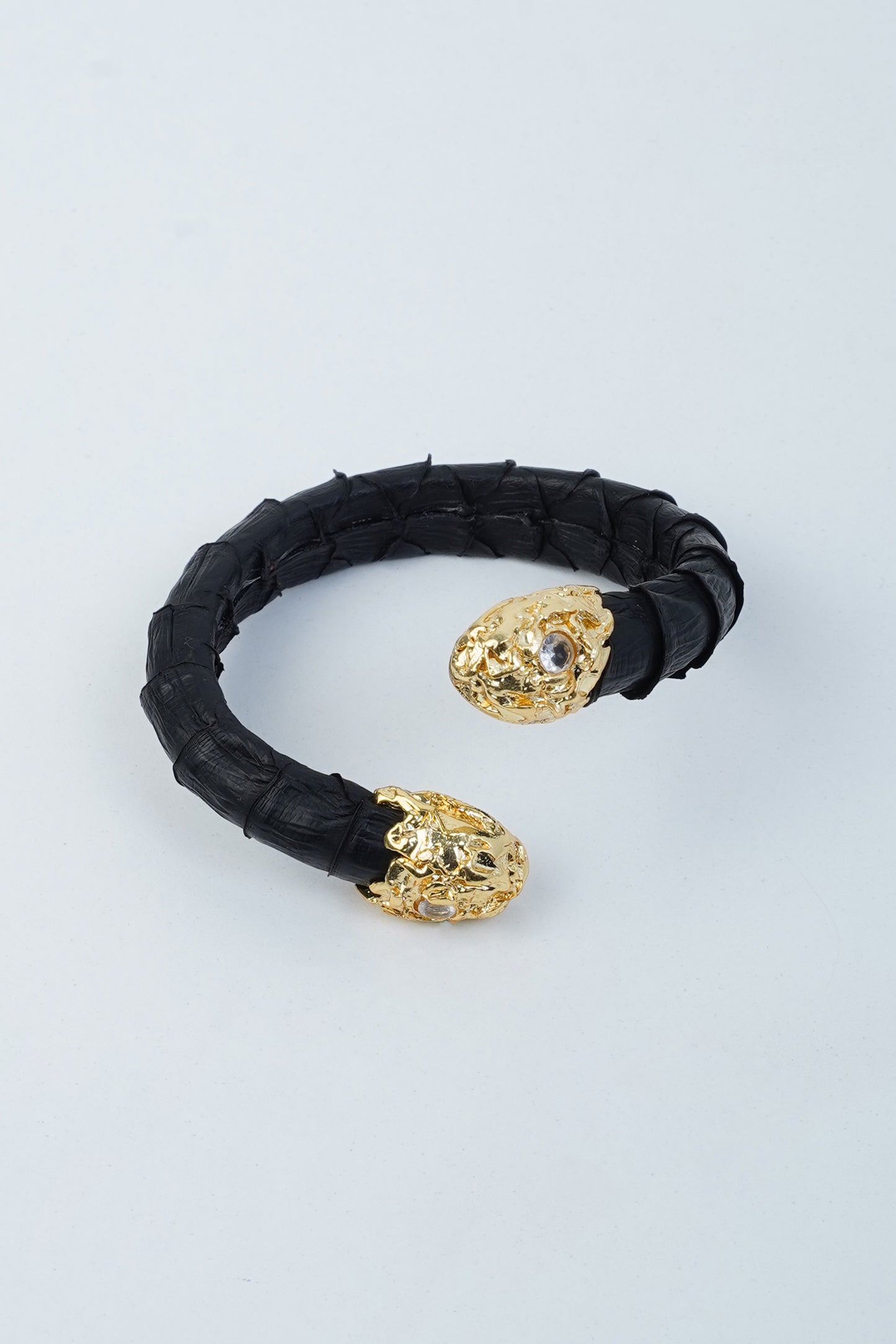Hierapolis black leather bracelet with handmade gold brass hook and python skin texture