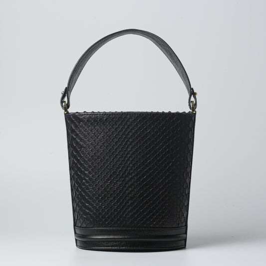Cesta Bag made of 100% python and calfskin leather, luxury bucket handbag with gold details.