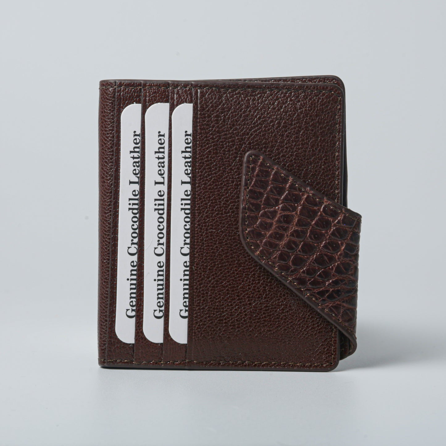 Brown leather wing wallet with ostrich detail and magnetic closure, unisex design.