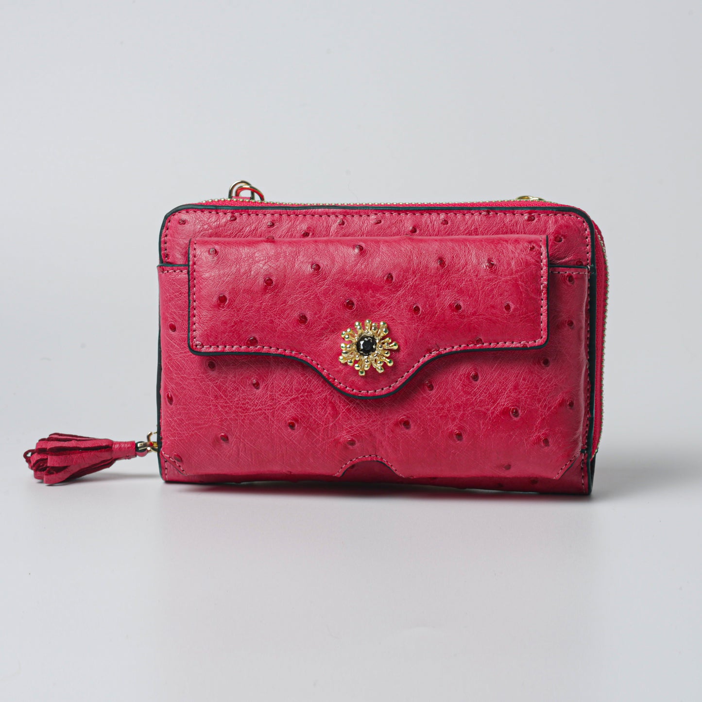 Raspberry bag made from 100% genuine ostrich leather with gold plated brass details, luxurious designer clutch.