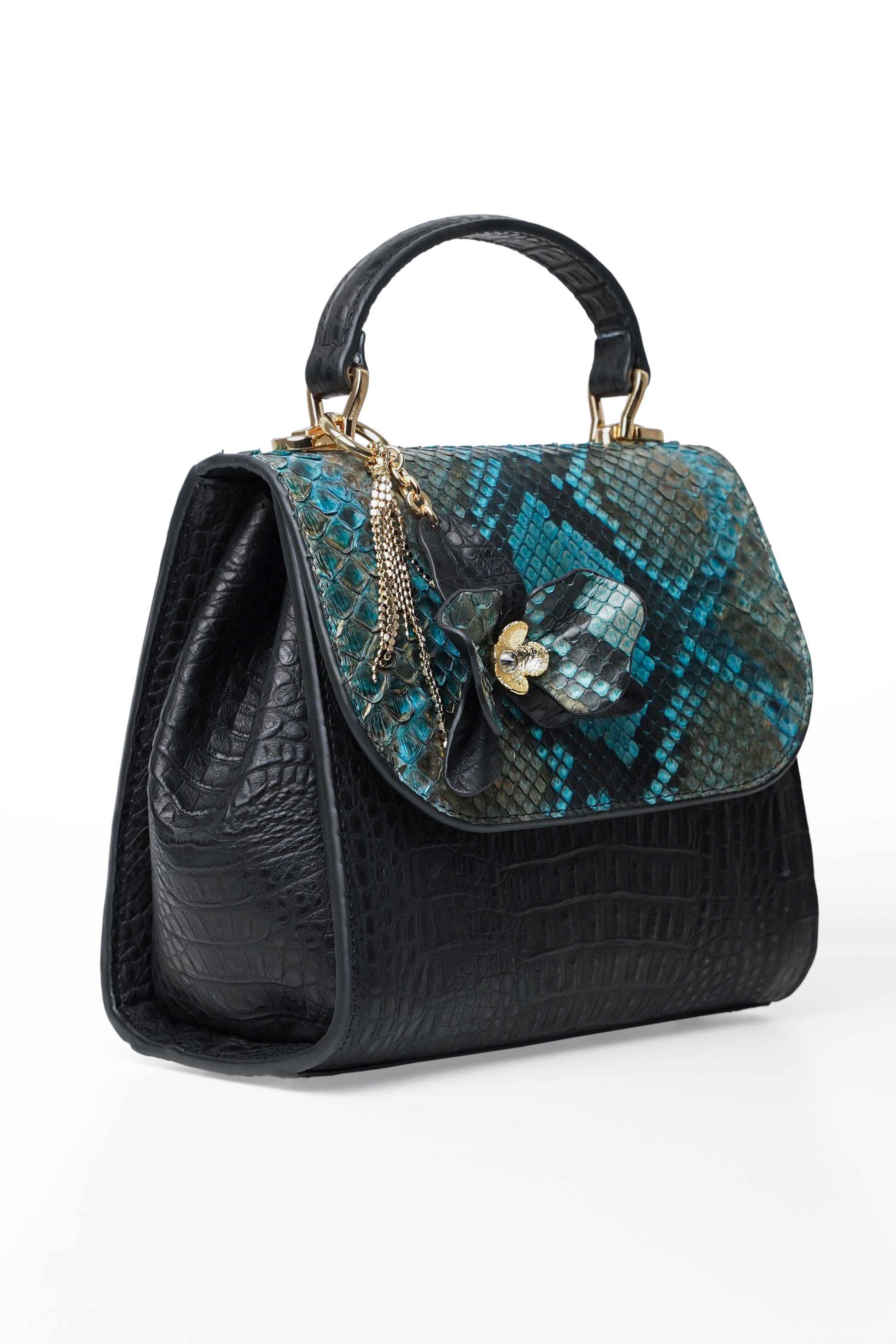 Blue leather orchid handbag with python cover and orchid flower detail.
