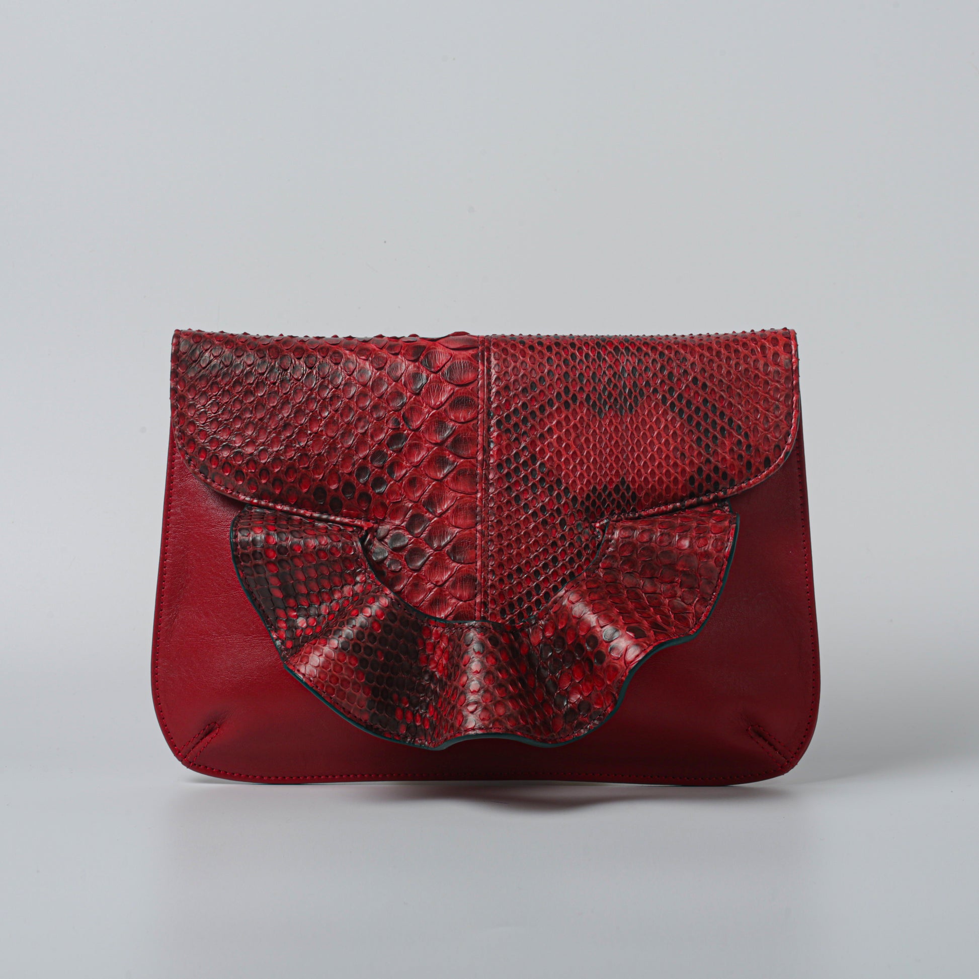 Emerald green handmade butterfly bag with python leather and calfskin.